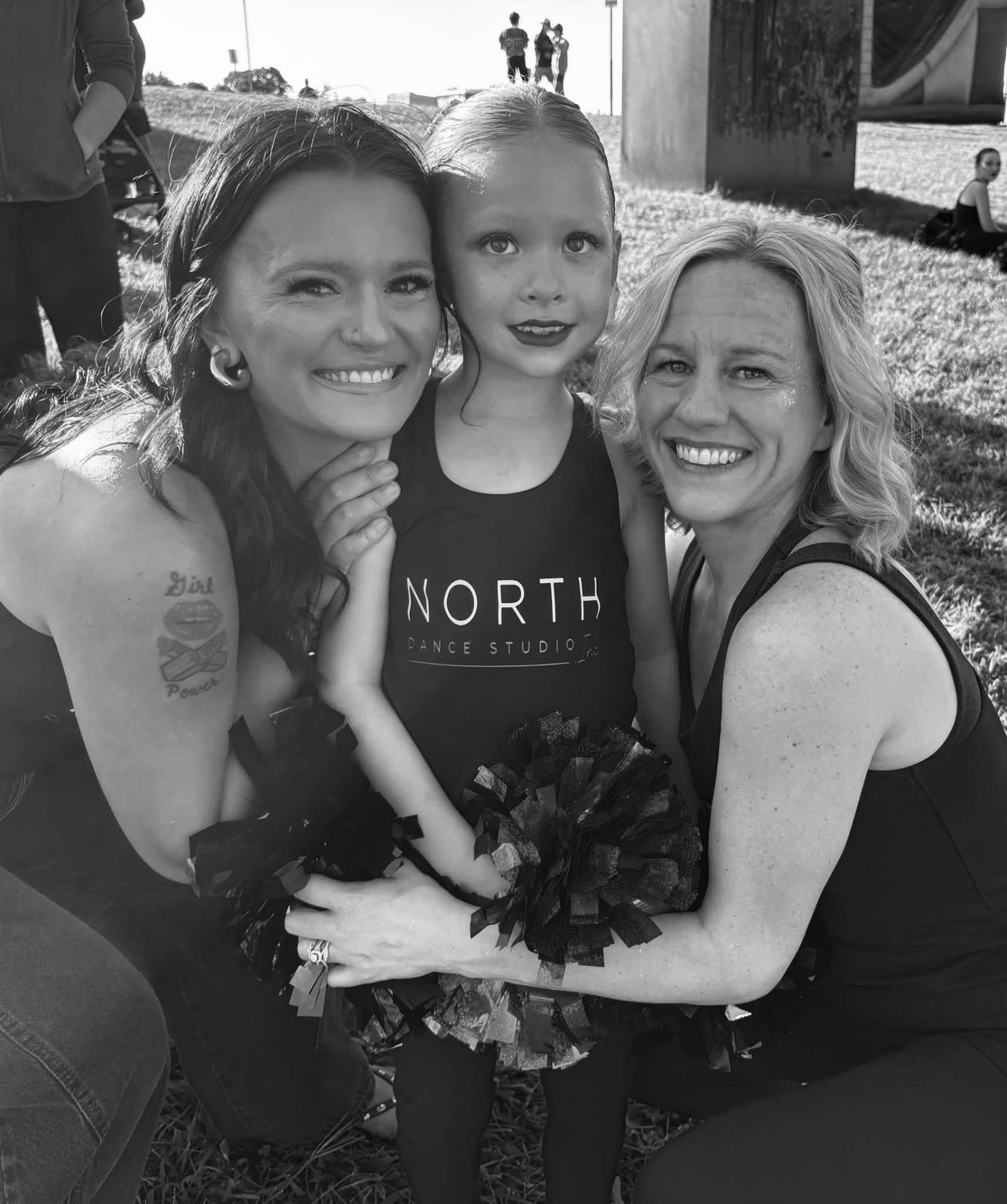 A young North Dance Studio dancer with two instructors