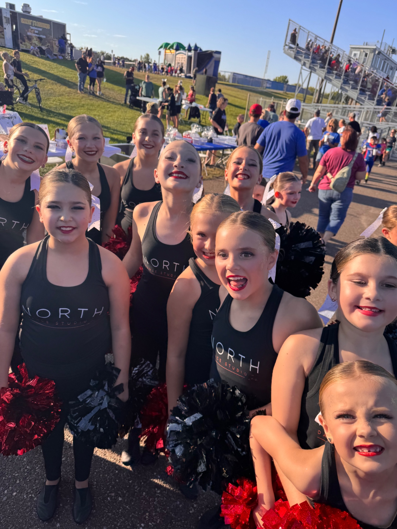 North Dance Studio dancers smiling together at a game
